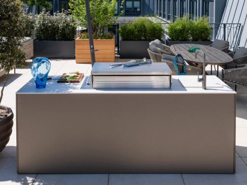 Outdoor kitchen with gas barbecue on rooftop terrace