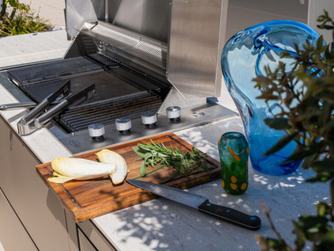Outdoor kitchen with gas barbecue on rooftop terrace